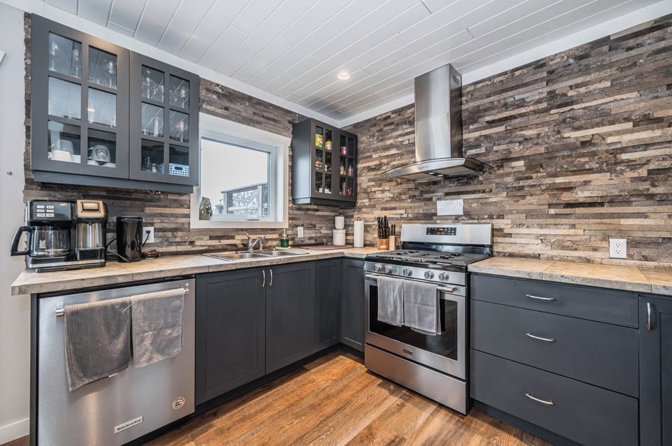 Modern kitchen with stainless steel appliances and everything you need to cook and entertain with ease.