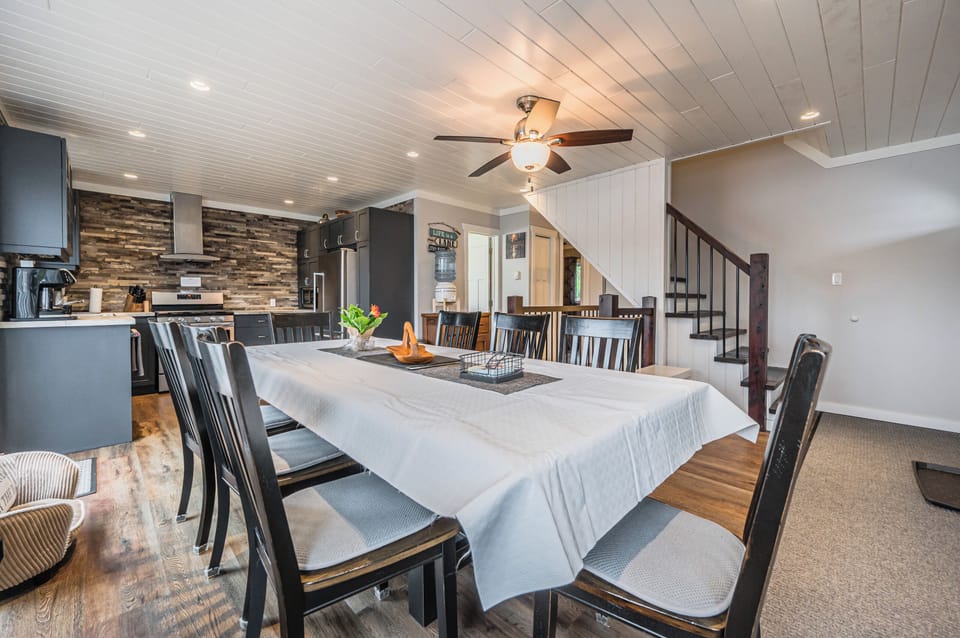 Large dining table—perfect for shared meals, games, and gathering together.