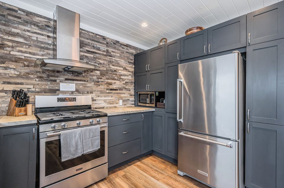 Spacious, fully equipped kitchen featuring premium finishes and plenty of prep space.