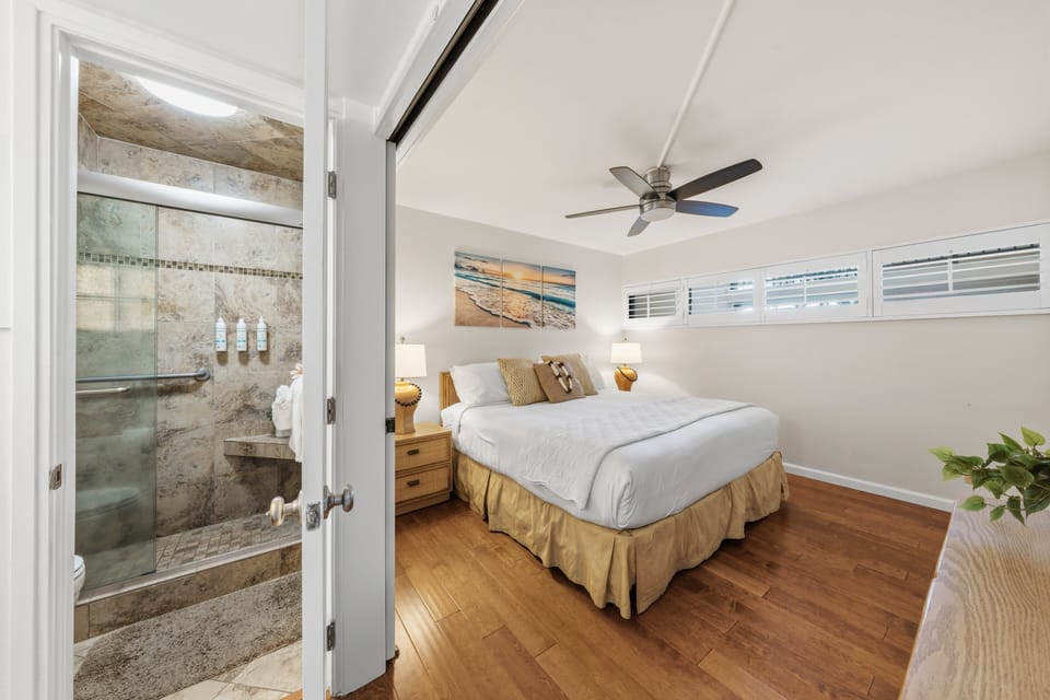 The master suite features a seamless transition to a private, updated bathroom for ultimate convenience.