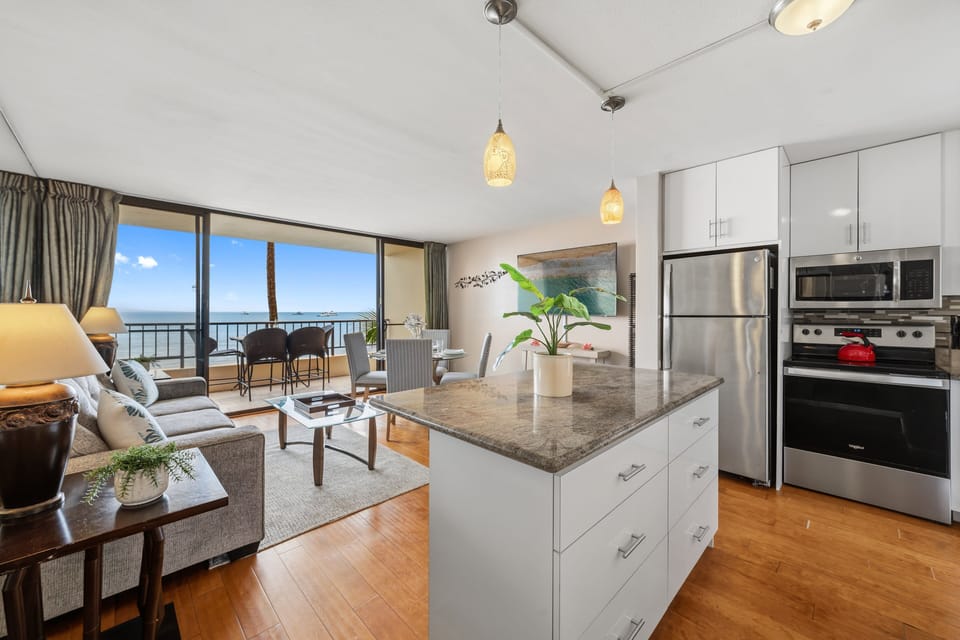 Contemporary island style meets panoramic coastal vistas in this spacious and sun-drenched great room.