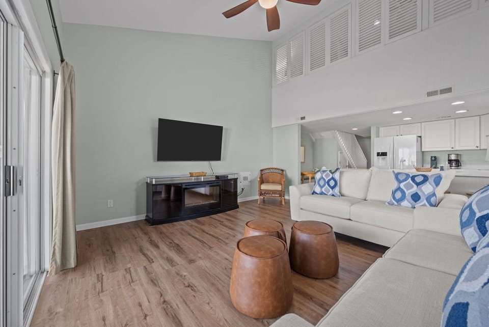 Airy living room connecting seamlessly to the kitchen and dining area