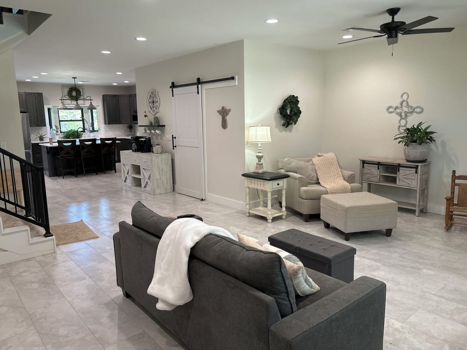 Living room opens to coffee bar and kitchen/ dining room 