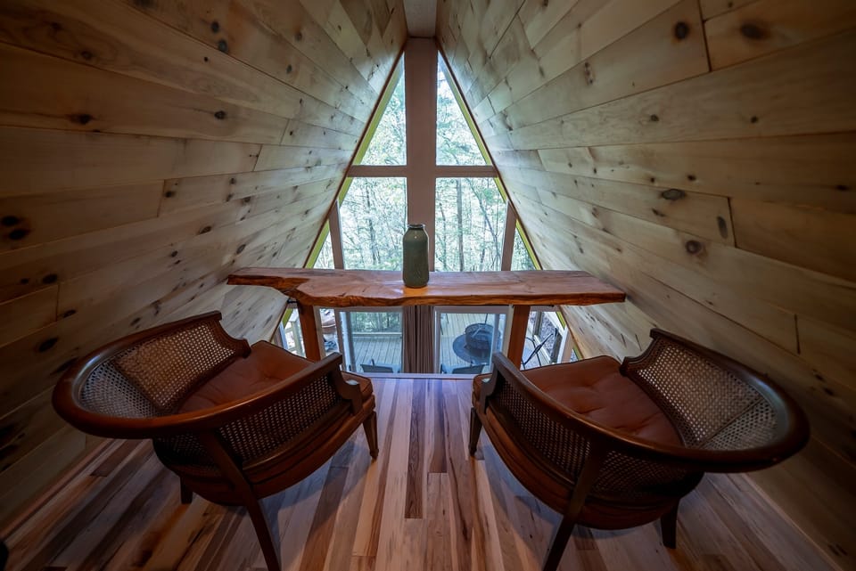 Start your morning here with a cup of coffee and a quiet view of the woods below.