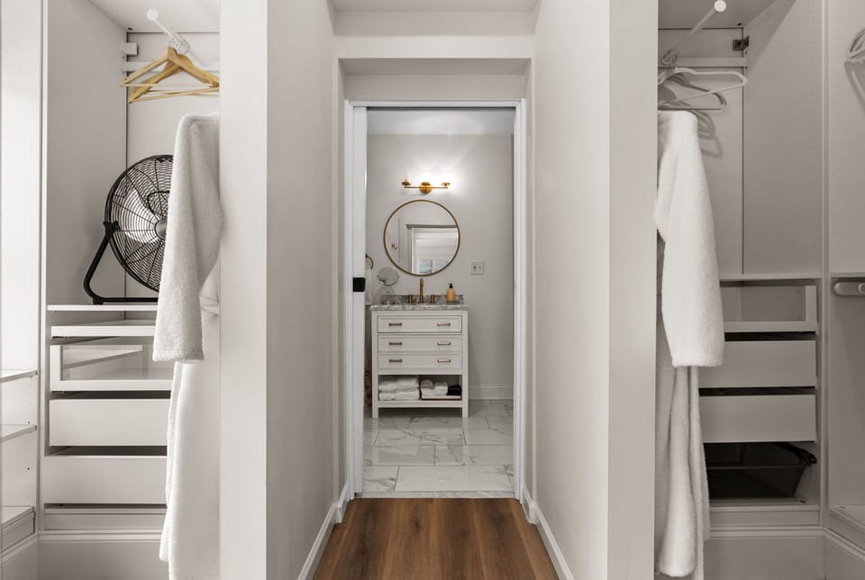 His & hers closets in the primary bedroom.