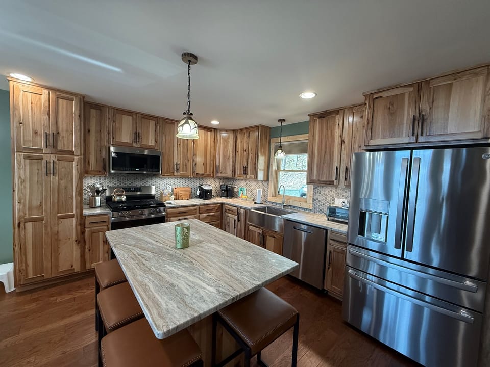 Chef's Kitchen with granite countertops and high-end appliances. 