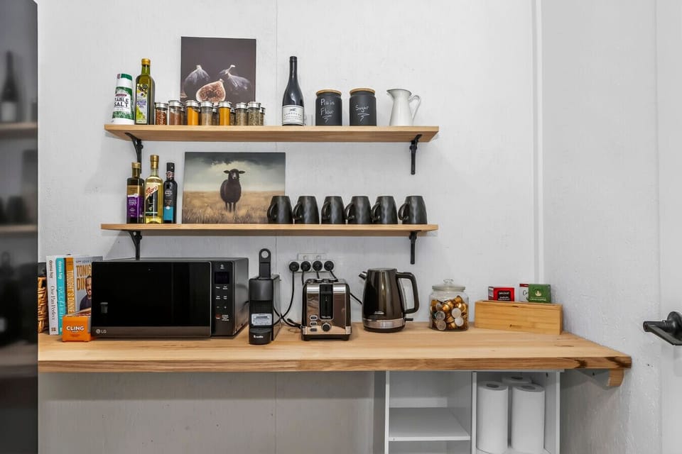 Cozy kitchenette with coffee and essentials.