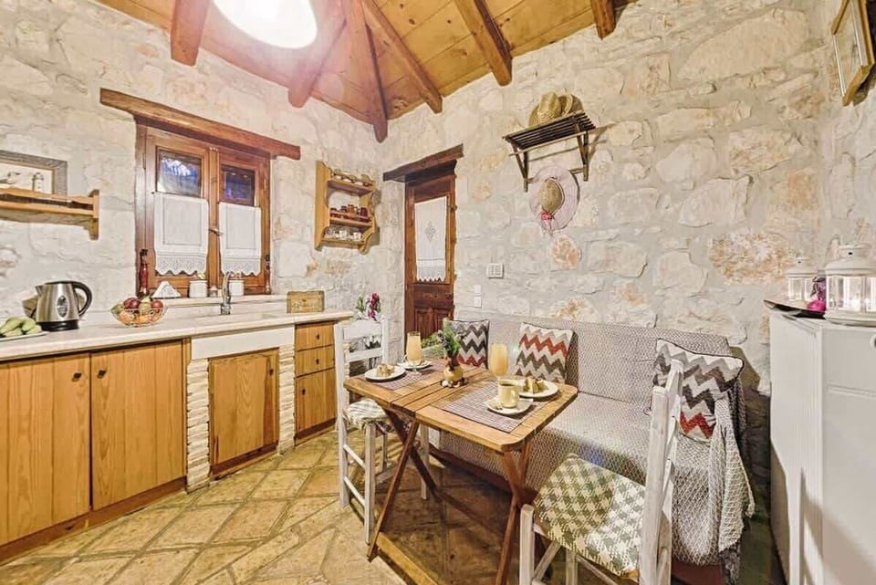 3. Kitchen

Fully equipped kitchen with modern appliances, wooden cabinets, and a cozy dining area, perfect for preparing and enjoying meals.