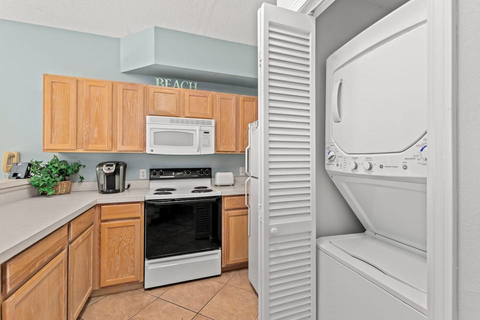 Your beach-themed kitchen comes equipped with everything you need, plus convenient in-unit washer and dryer for effortless vacation laundry.