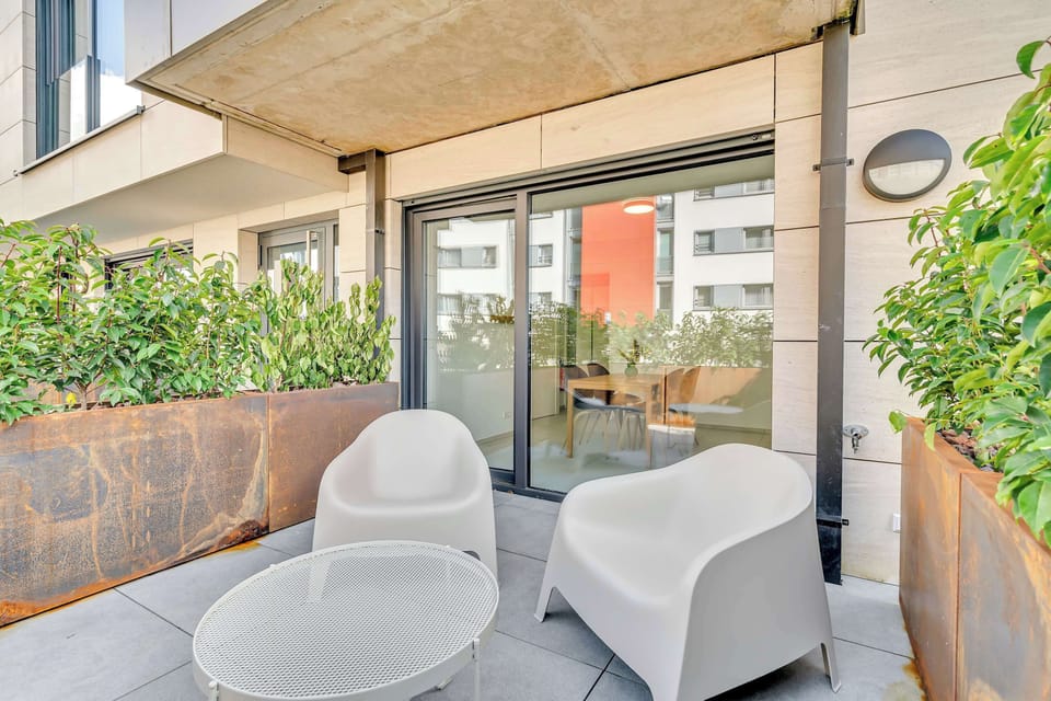 Cozy terrace corner with seating, ideal for morning coffee or evening relaxation.