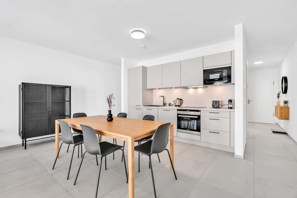 Fully equipped kitchen and dining space with a clean and modern design.