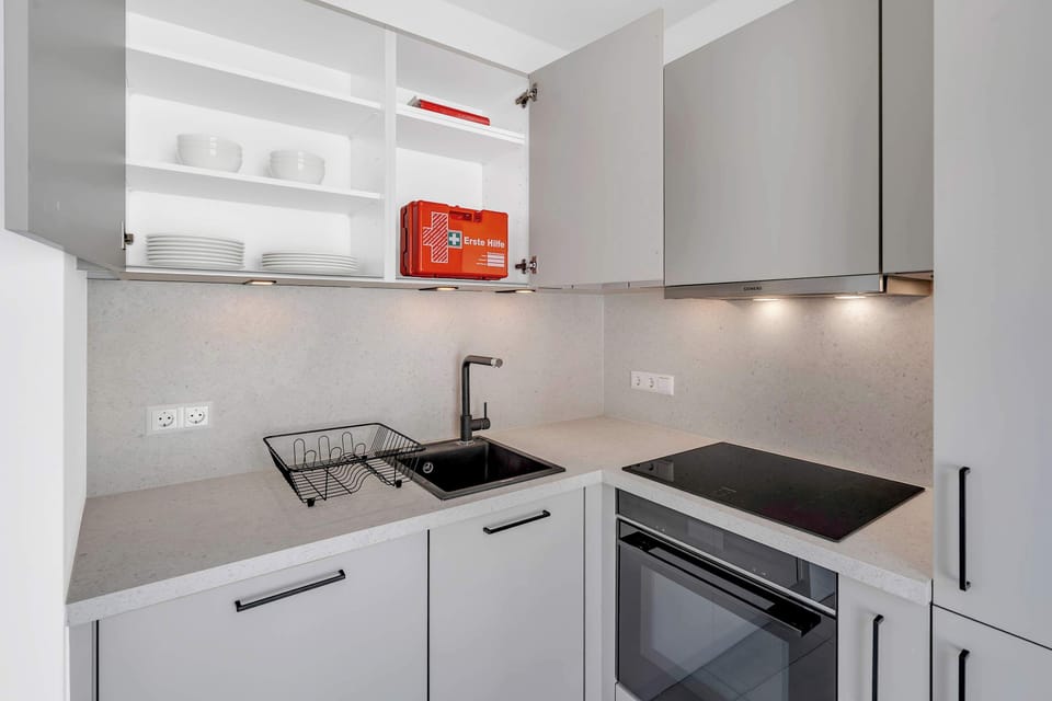 Kitchen with open shelving and storage, designed for convenience and functionality.