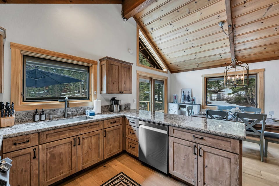 Kitchen: Drip coffee maker, Crockpot, blender, kettle, cooking utensils, tableware, main floor 

