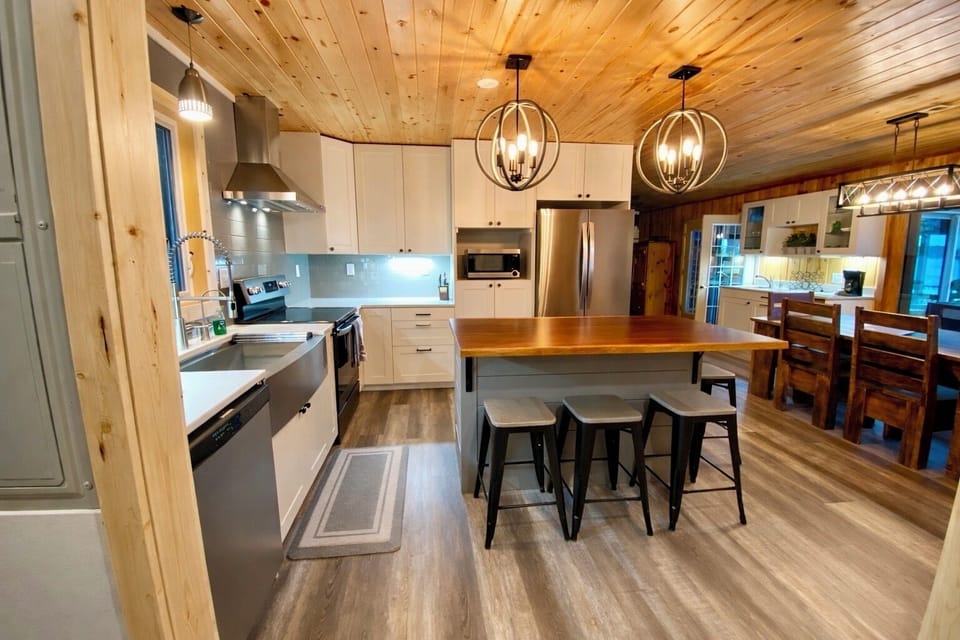 This updated kitchen welcomes you in with a fresh, modern feel, beautiful light, and plenty of space to gather. Functional, stylish, and central to the home, it’s perfect for everything from morning coffee to family dinners.