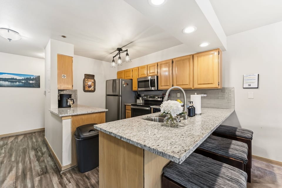  Kitchen: Drip coffee maker, Crockpot, blender, toaster, cooking utensils, tableware 
