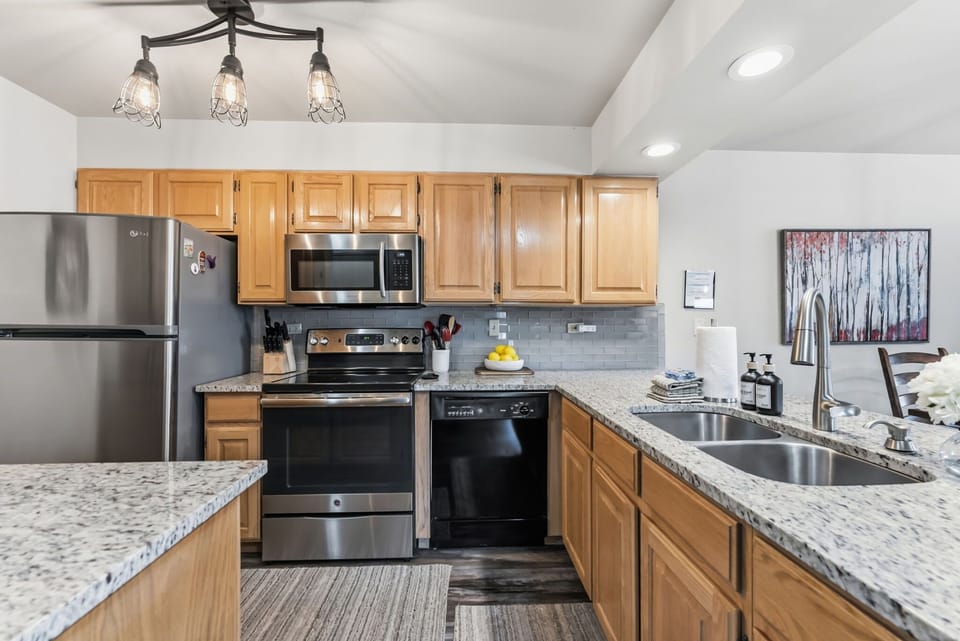  Kitchen: Drip coffee maker, Crockpot, blender, toaster, cooking utensils, tableware 
