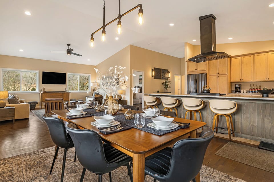 The home showcases an organic mountain-modern design with an open-concept layout