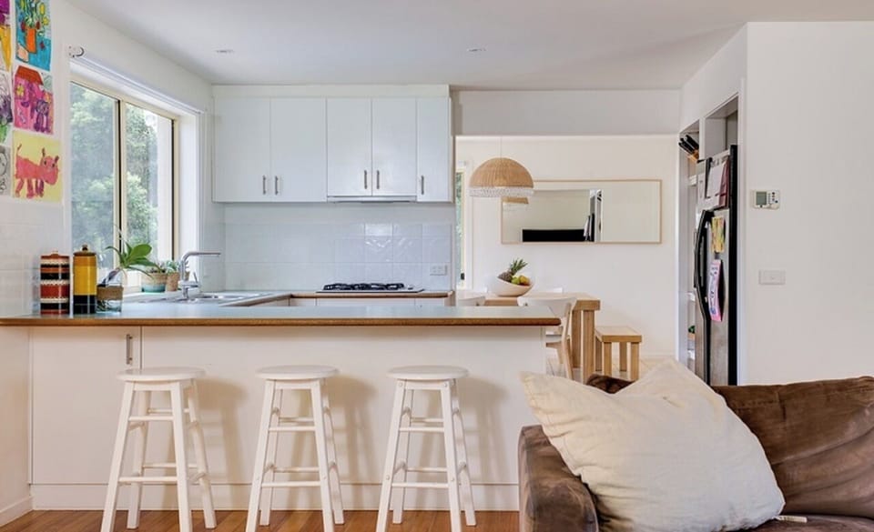 Fully equipped kitchen with cooktop, oven, fridge and dishwasher