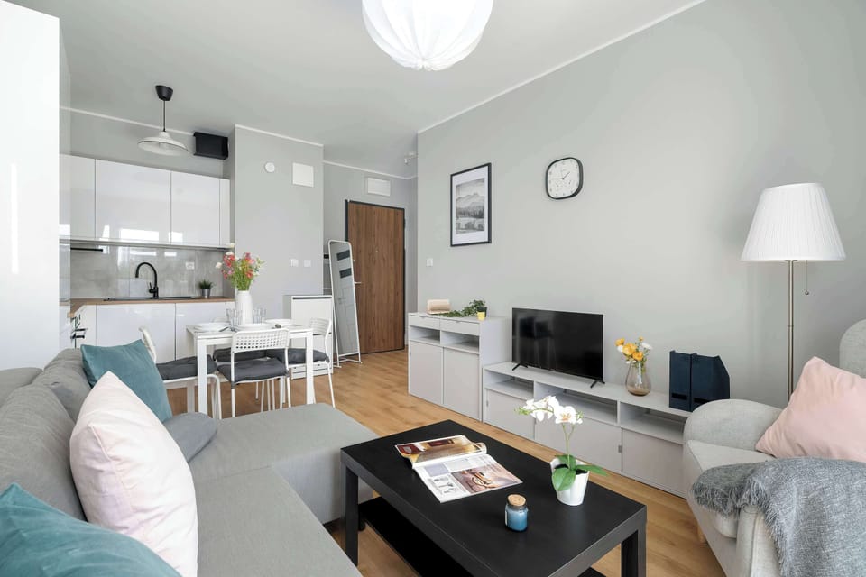 The living room has a modern look and comfortable furniture.