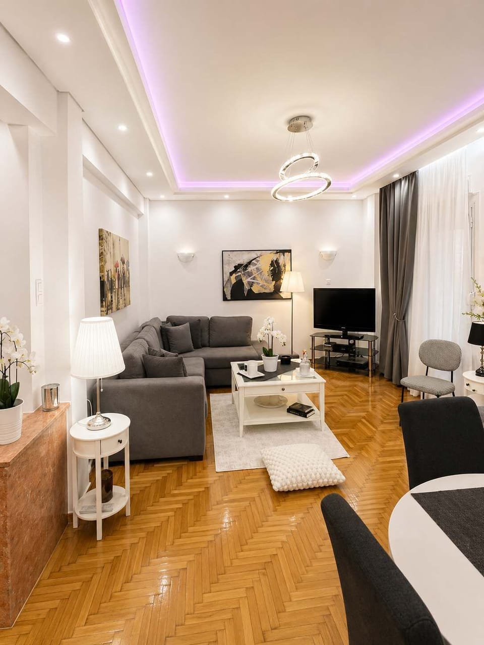 Spacious Open-Plan Living Area with Designer Ceiling Lights
