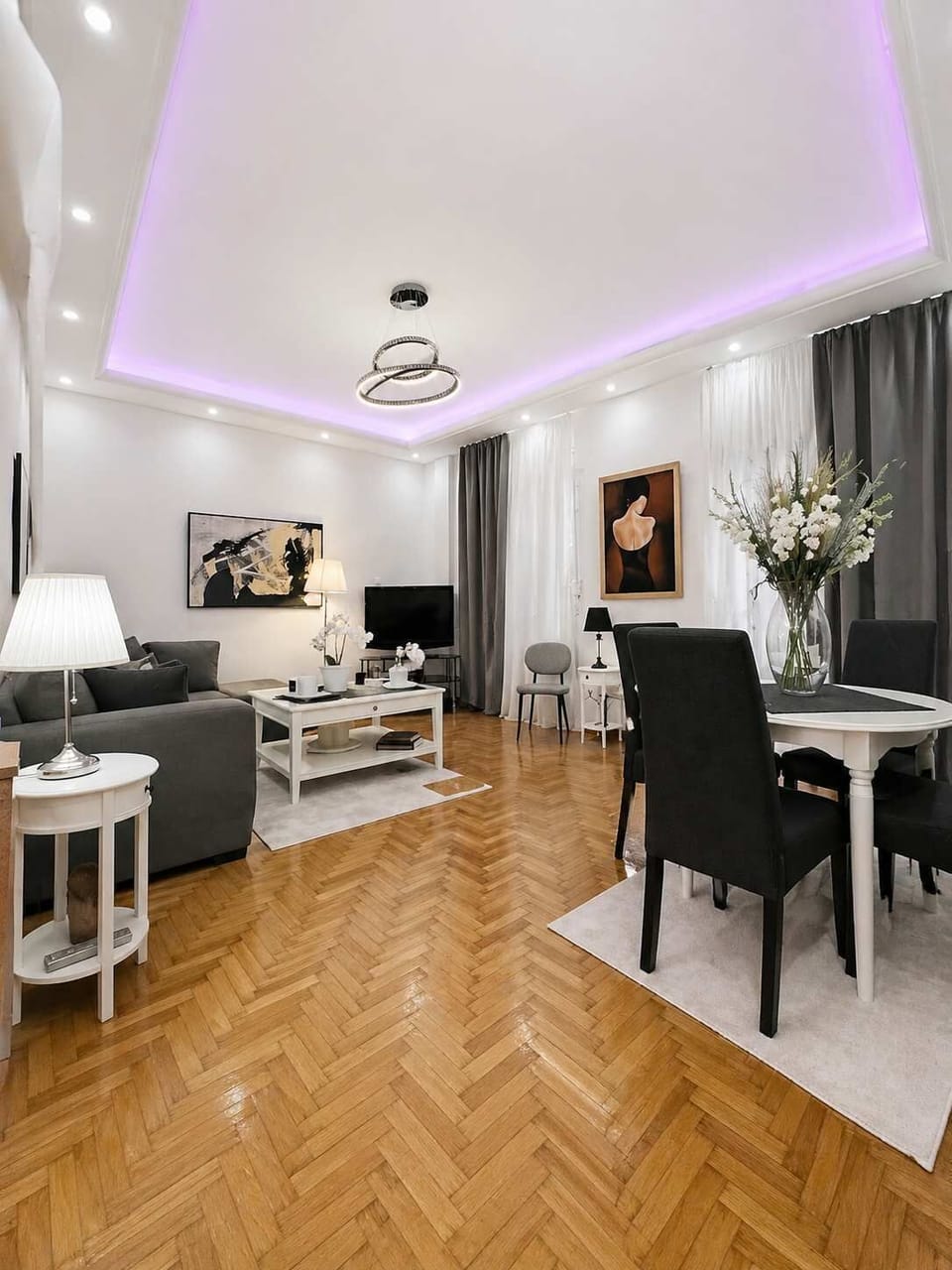Elegant Living Room with Dining Area & Ambient Lighting