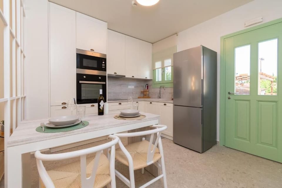 Bright Kitchen with Dining Setup and Functional Layout