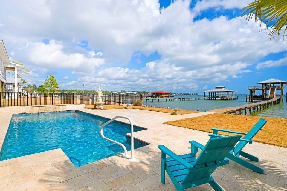 Waterfront private pool, expansive patio, and direct dock access for the ultimate coastal getaway.