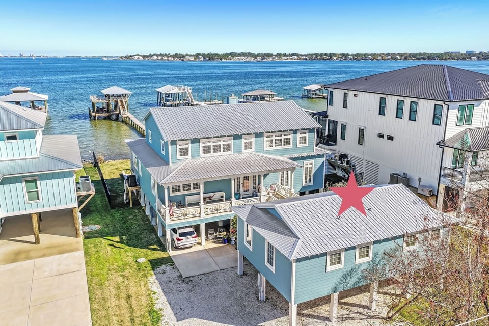Bright, breezy coastal getaway featuring a private dock ideal for boating, fishing, or simply relaxing by the water.