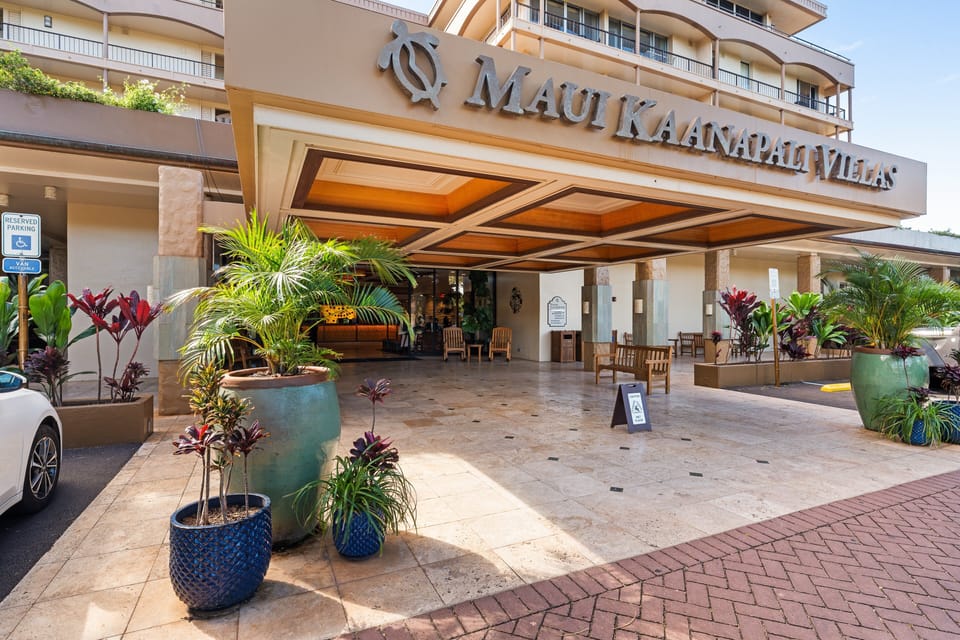 Welcoming resort entrance surrounded by lush tropical landscaping
