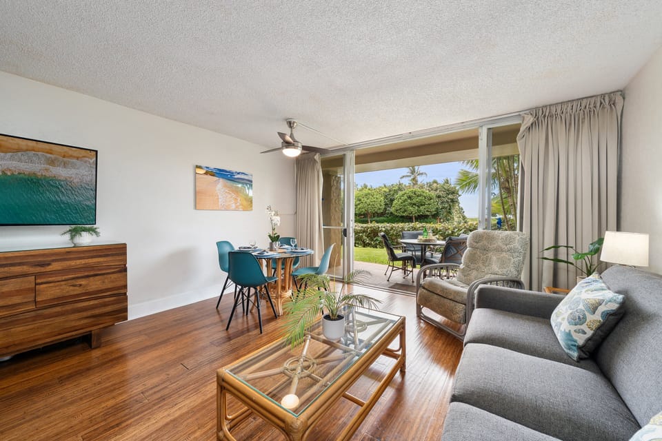 Welcoming living area with open access to the lanai, perfect for enjoying fresh air and garden views.