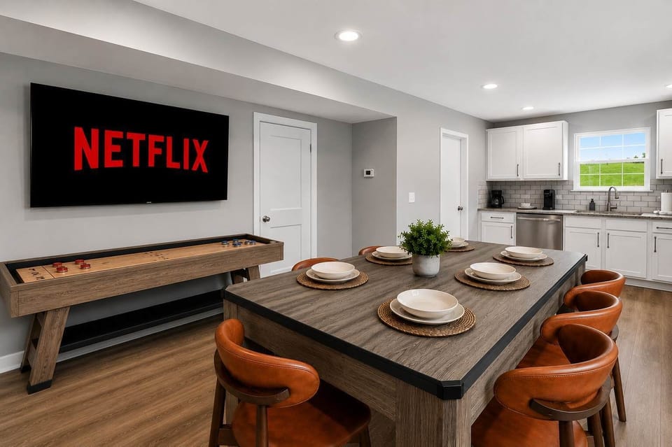 Dining Area 1: Gather around the dining table in Unit A, offering a comfortable space for shared meals, game nights, remote work, or planning your adventures.