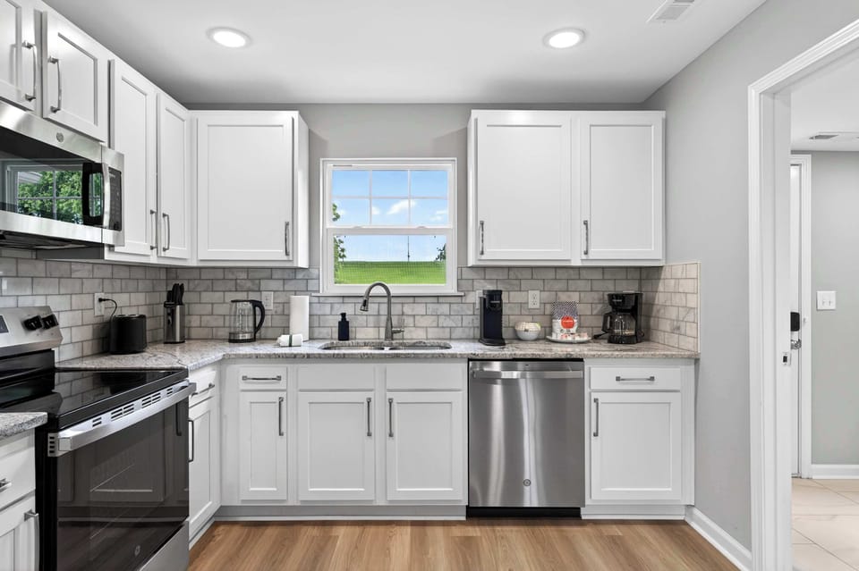Kitchen: The spacious kitchen offers modern appliances, cookware, and plenty of room to prepare and enjoy your favorite meals.