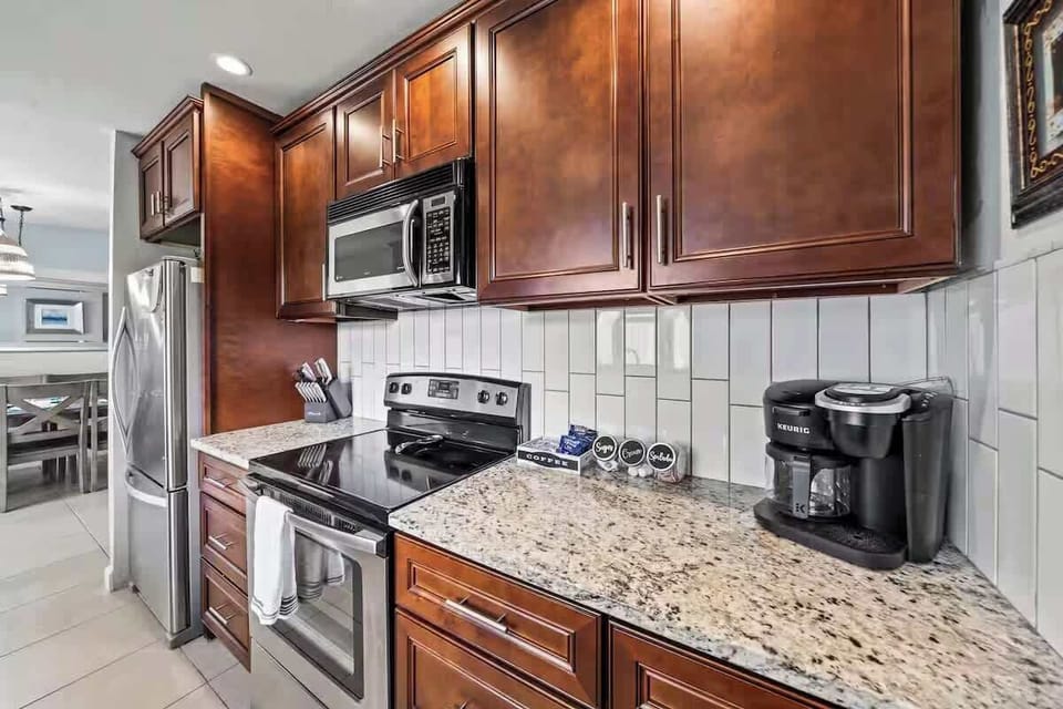 Modern kitchen with granite countertops and stainless steel appliances