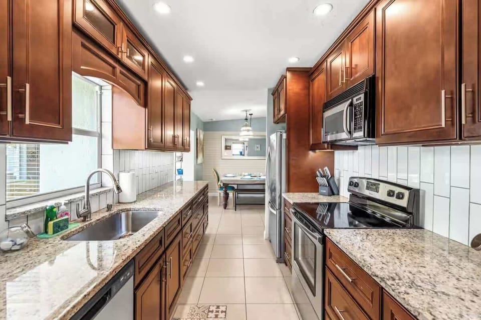 Modern kitchen with granite countertops and stainless steel appliances
