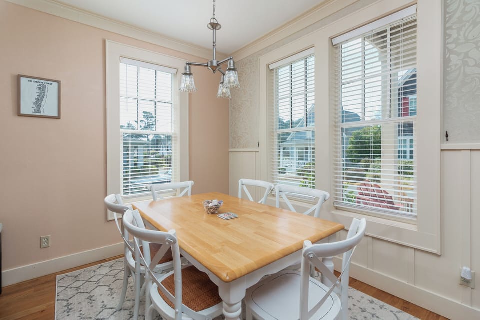 Gather around this charming dining table where your group can enjoy meals together in bright, welcoming surroundings.