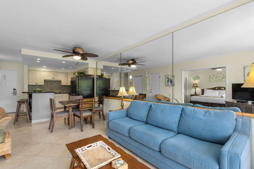 Unwind in your open-concept haven where coastal charm meets modern comfort, complete with a fully equipped kitchen and inviting living spaces.