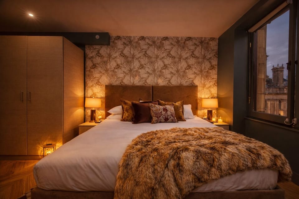 Thoughtful touches throughout — crisp linens, plush pillows, and bedside USB charging for your convenience