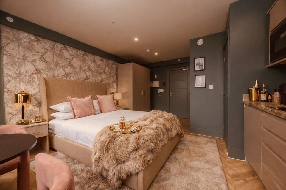 Comfortable double bedroom with hotel-quality bedding, blackout blinds, and warm ambient lighting for a restful night's sleep