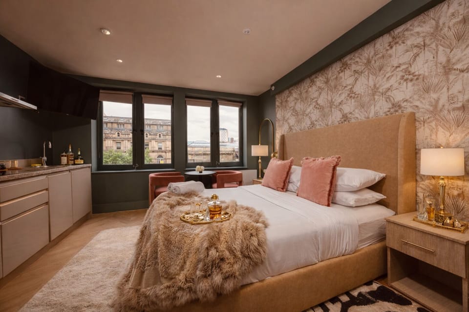 Comfortable double bedroom with hotel-quality bedding, blackout blinds, and warm ambient lighting for a restful night's sleep