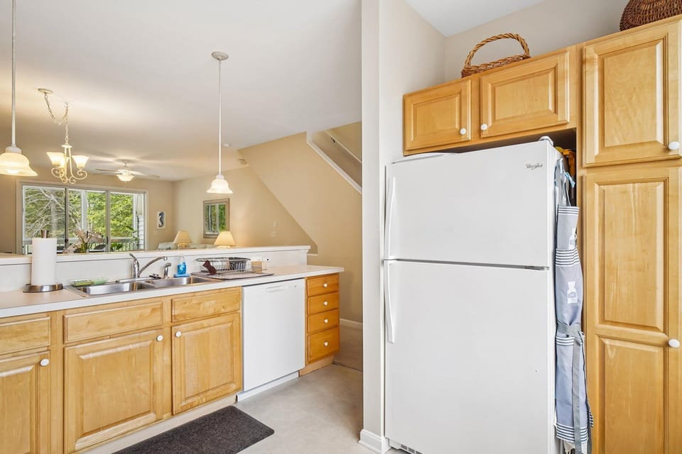 Whip up your favorite meals in this bright, fully equipped kitchen with modern appliances, plenty of counter space, and natural light streaming in through the windows.