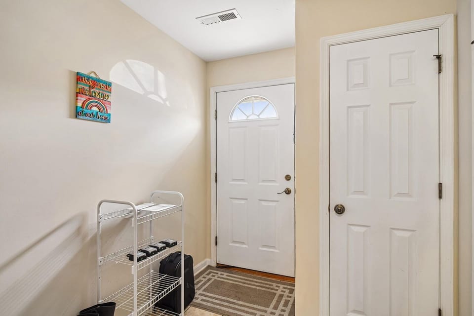 Step into your welcoming entryway with bright natural light and convenient storage for shoes and essentials—perfect for easy arrivals and departures.