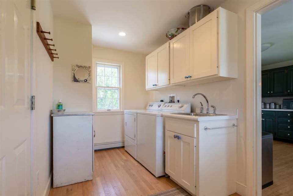 Laundry off kitchen and wet bar