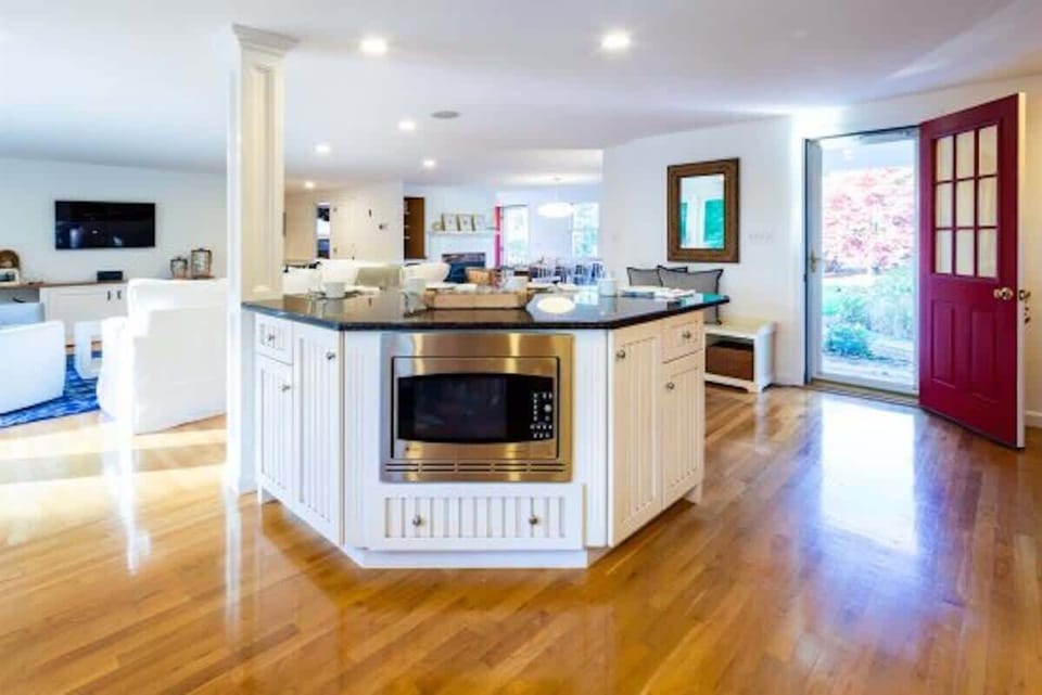 Kitchen opens up to living and dining area