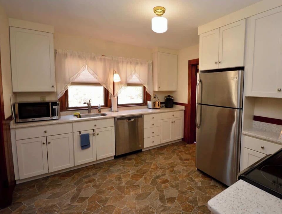 Full kitchen with door to backyard. Laundry room attached.