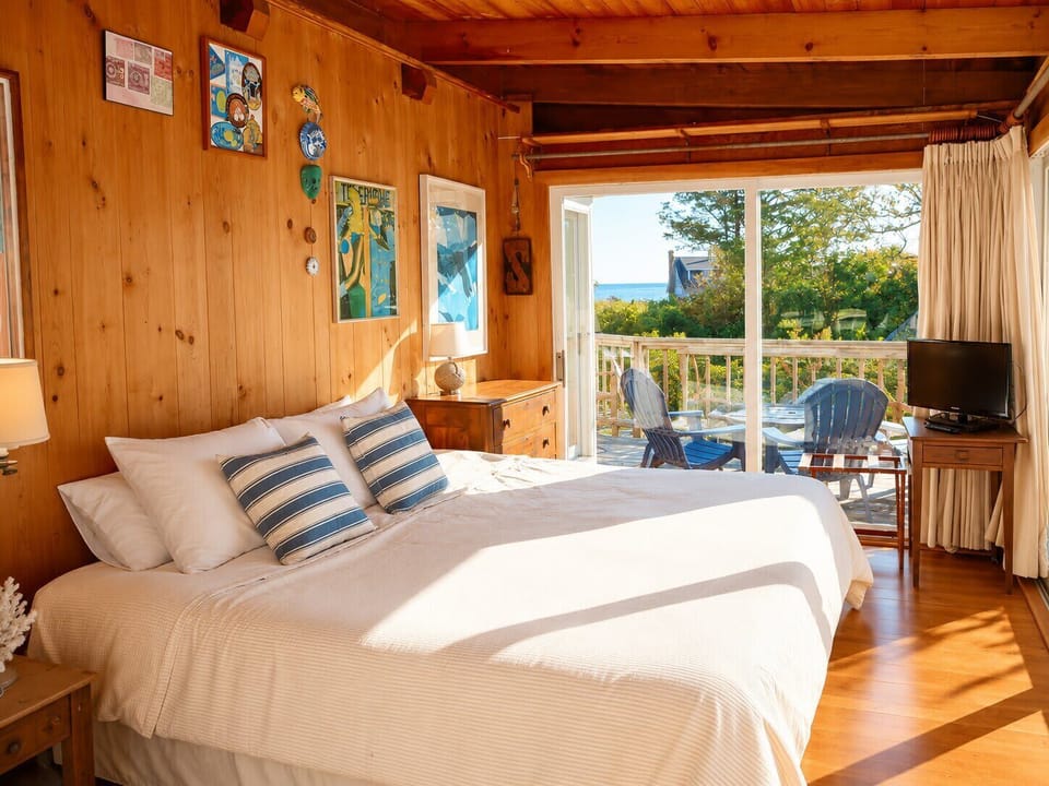 King Size master bedroom with AC - main floor. Wonderful light and views in this room of glass don`t worry full floor to ceiling heavy curtains for sleeping