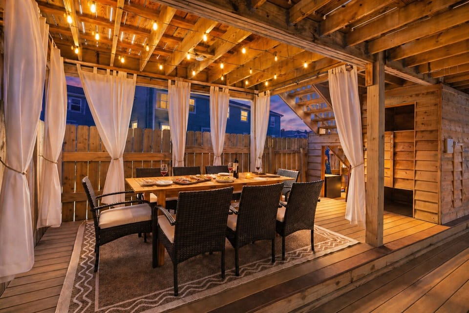 Lower deck seating/dining area with string lights