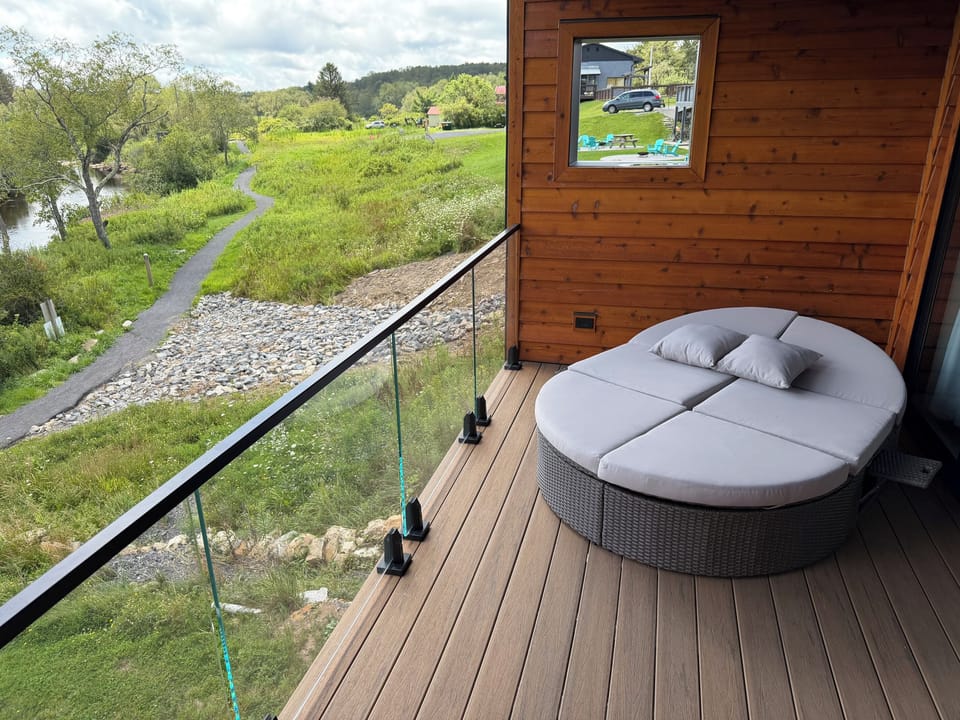 After an outside shower or tub soak, enjoy the private porch with chaise for two.