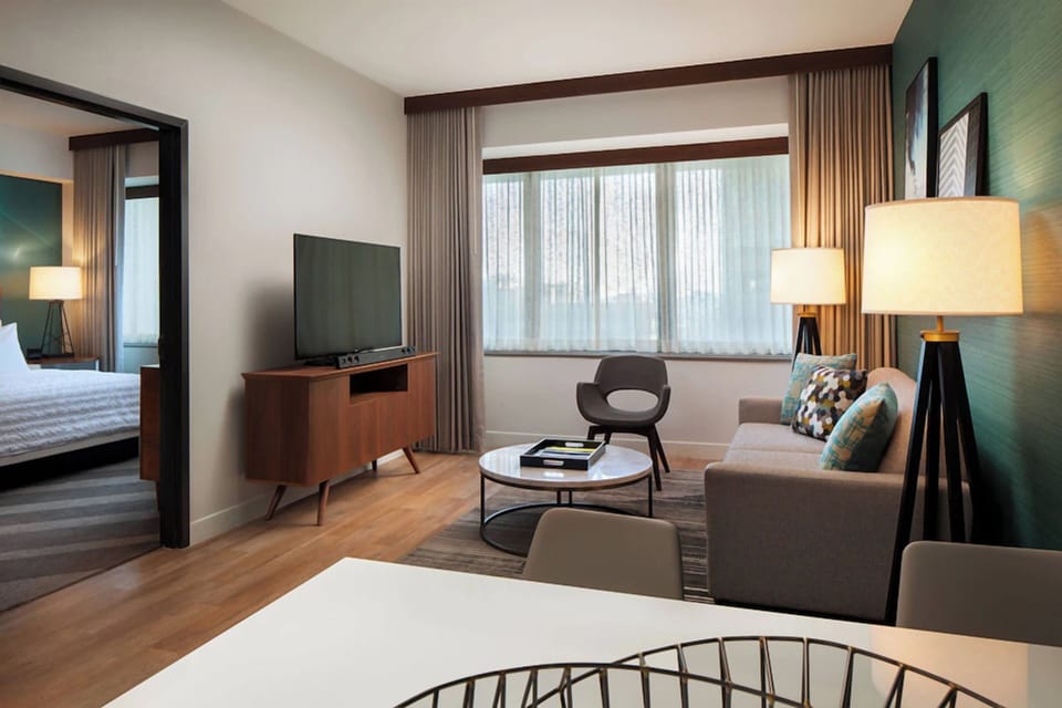 Lounge comfortably with warm lighting and an inviting seating area