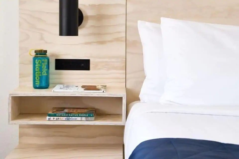 Enjoy thoughtful bedside details for a calm, clutter-free stay.