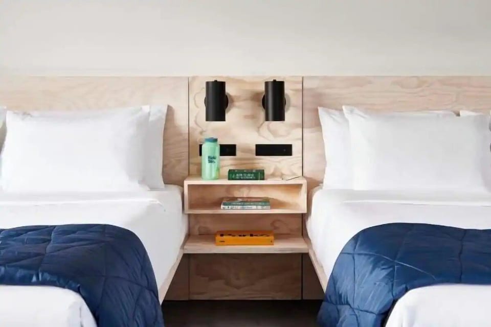 Drift off beside softly lit nightstands and cozy throws.